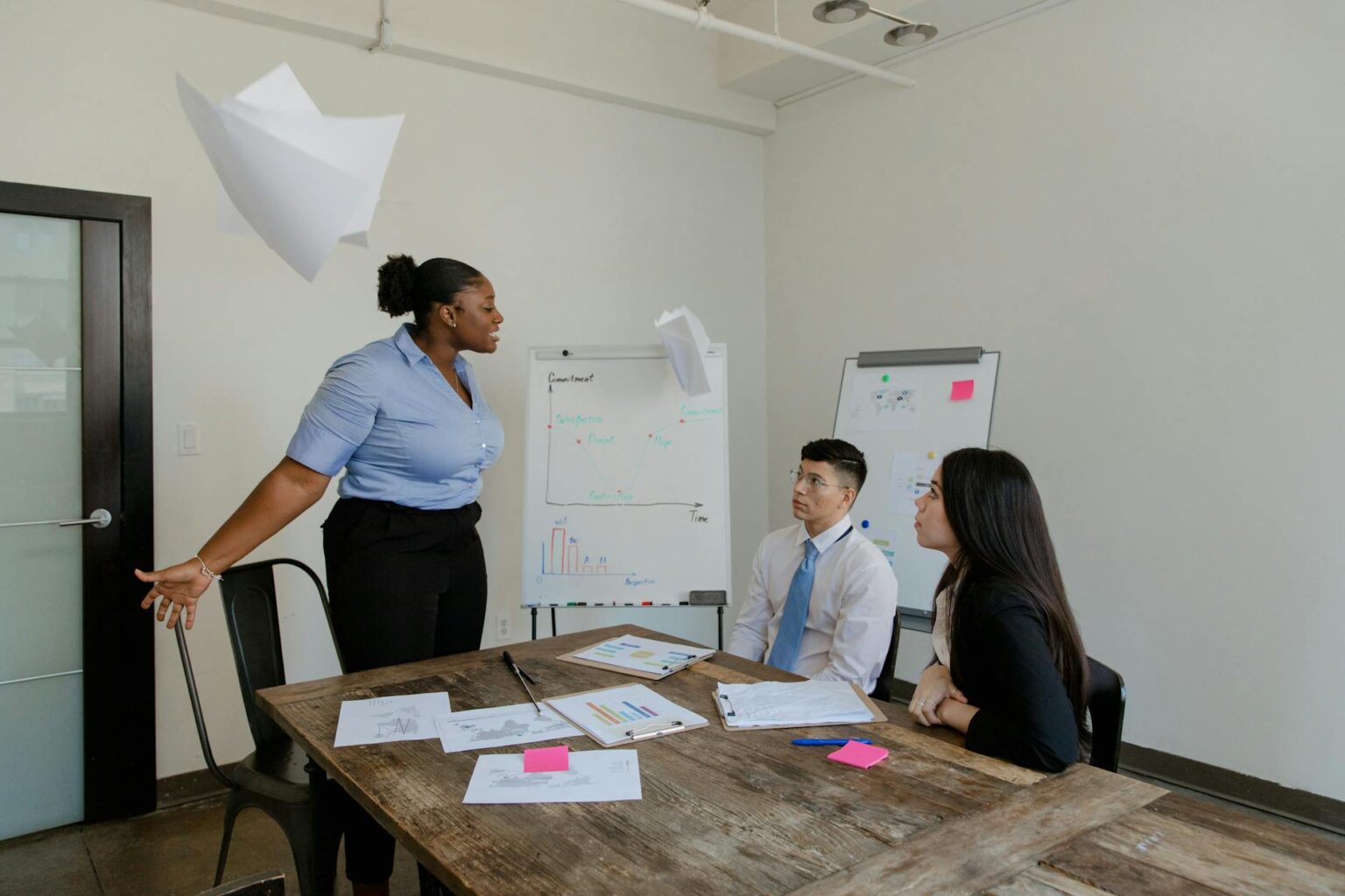 Corporate Mentorship Programs Are Quietly Replacing Formal Management Training Two professionals in a structured one-on-one meeting in a modern office setting