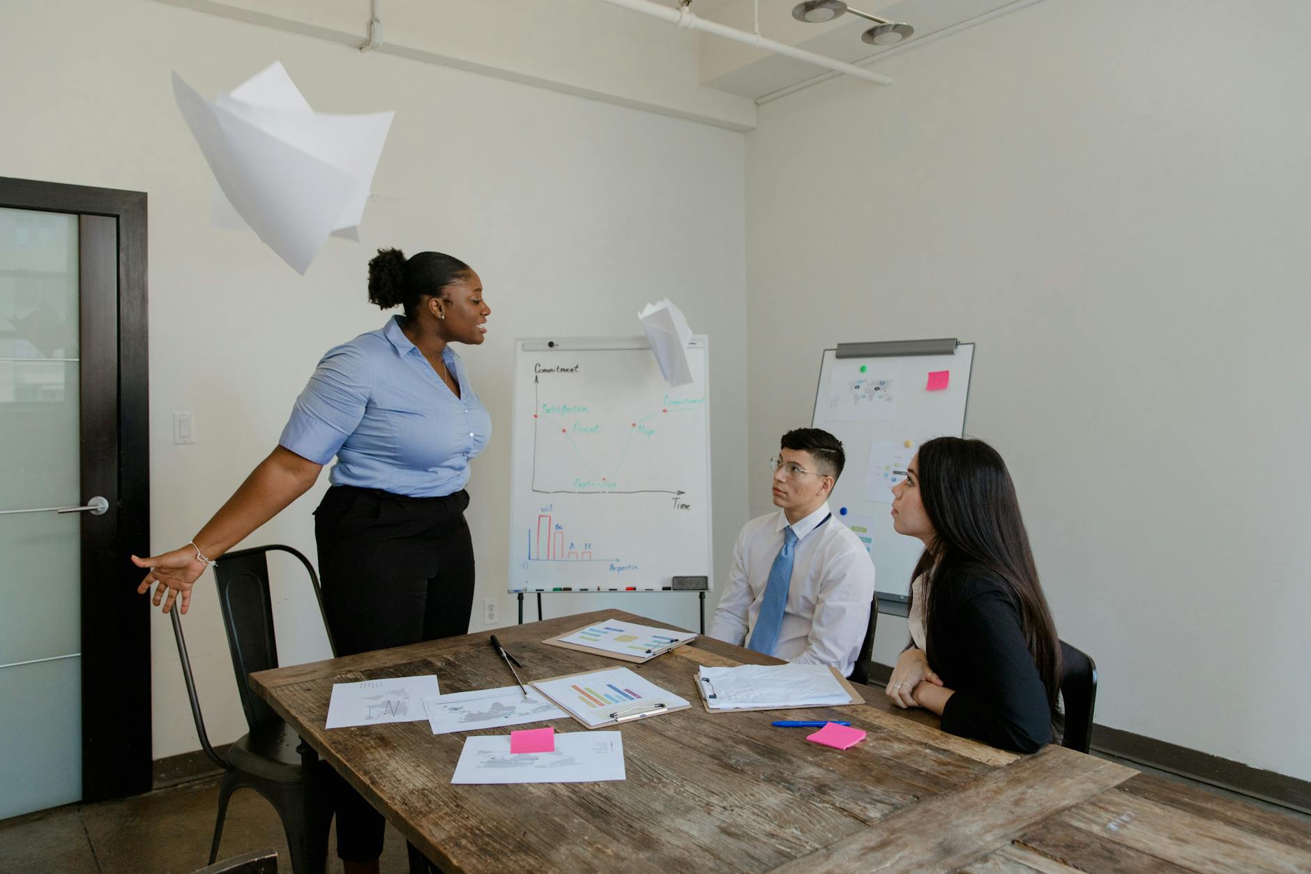 Two professionals in a structured one-on-one meeting in a modern office setting
