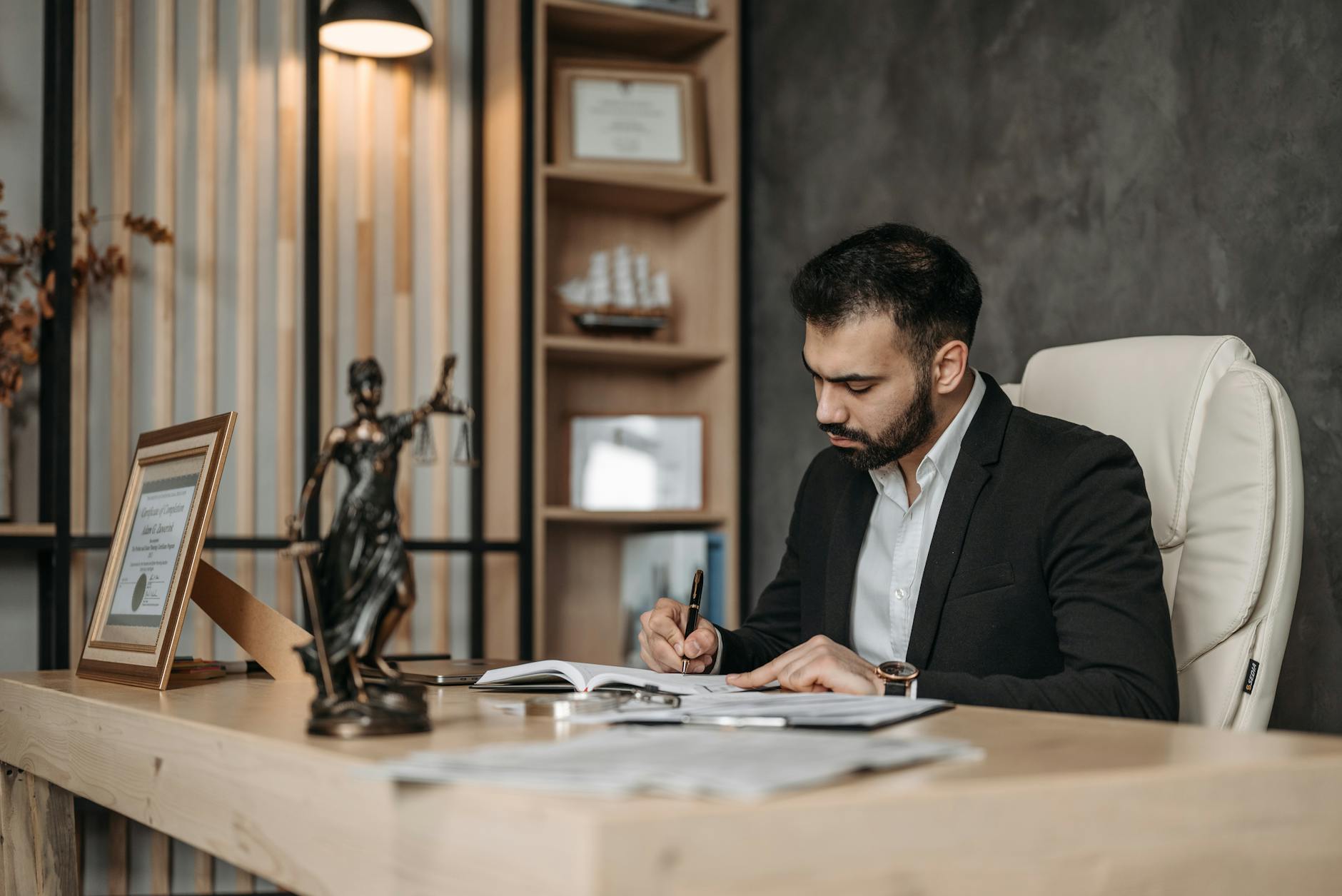 Corporate legal department office with attorneys reviewing documents at a conference table