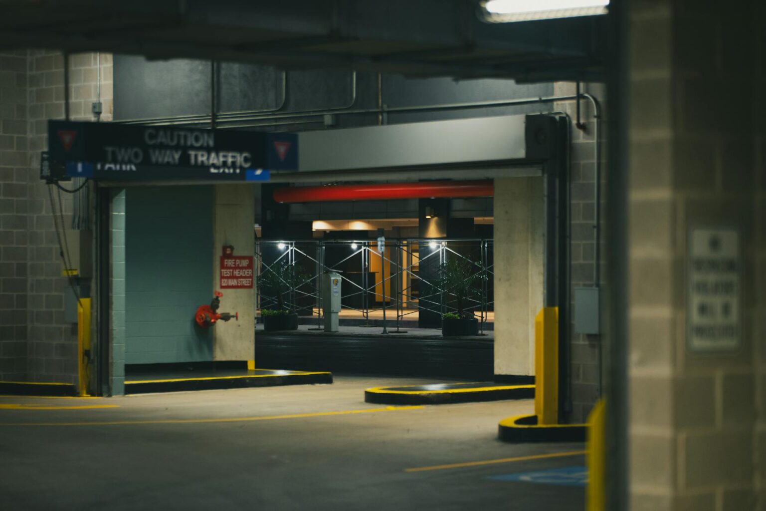 Major Hotel Chains Are Installing EV Charging Stations in Parking Garages Interior view of modern hotel parking garage with multiple levels and lighting