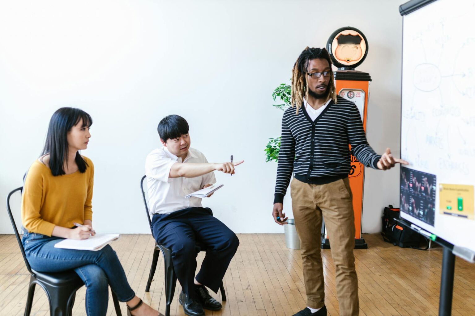 Corporate Tuition Reimbursement Programs Are Shifting Toward Trade School Certifications Professional training session with employees learning new skills in a corporate classroom setting