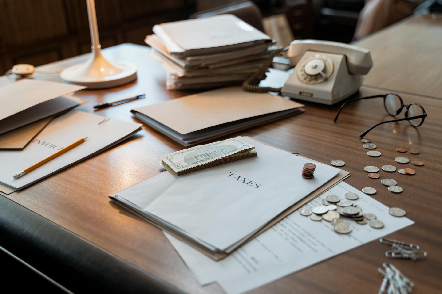 Stacks of cash on a desk representing corporate cash reserves and financial hoarding