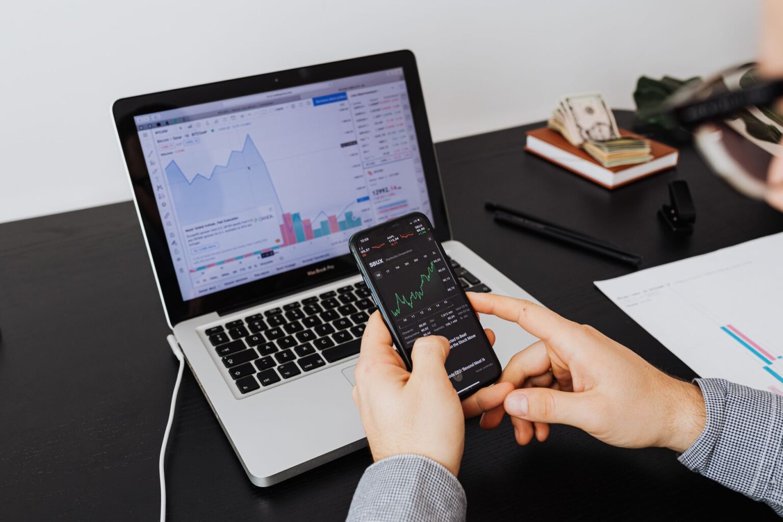 Finance professionals reviewing bond documents in a modern tech office setting
