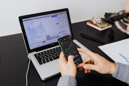 Finance professionals reviewing bond documents in a modern tech office setting