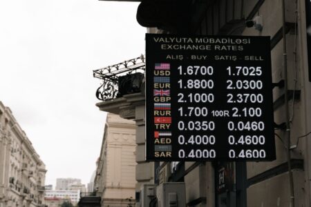 Currency exchange board showing multiple international currencies and exchange rates