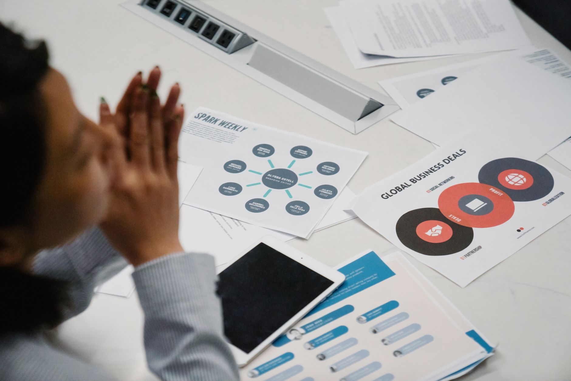 Institutional investors reviewing risk management strategy documents in a boardroom setting