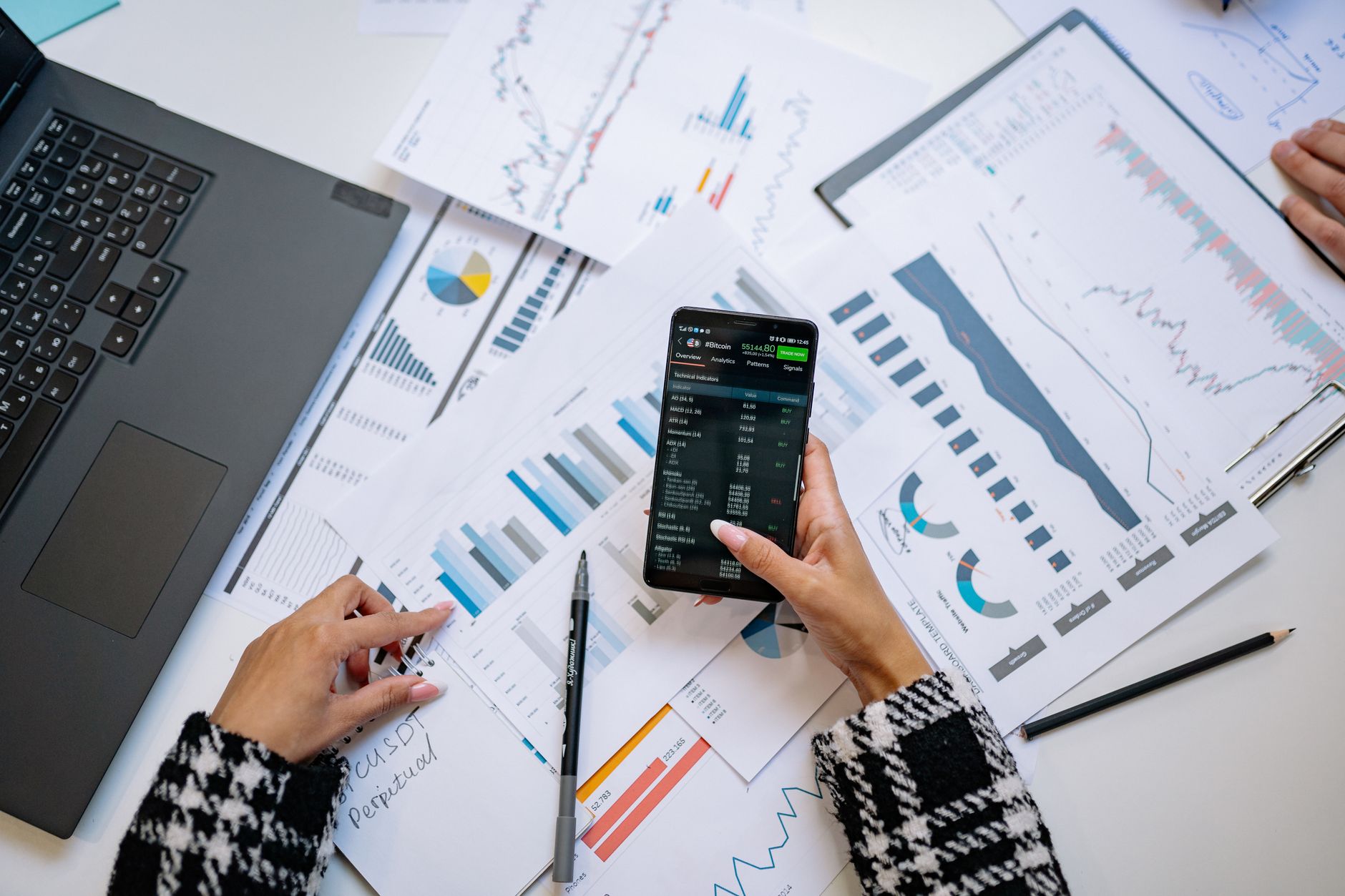 Financial data displayed on computer screens showing market analytics