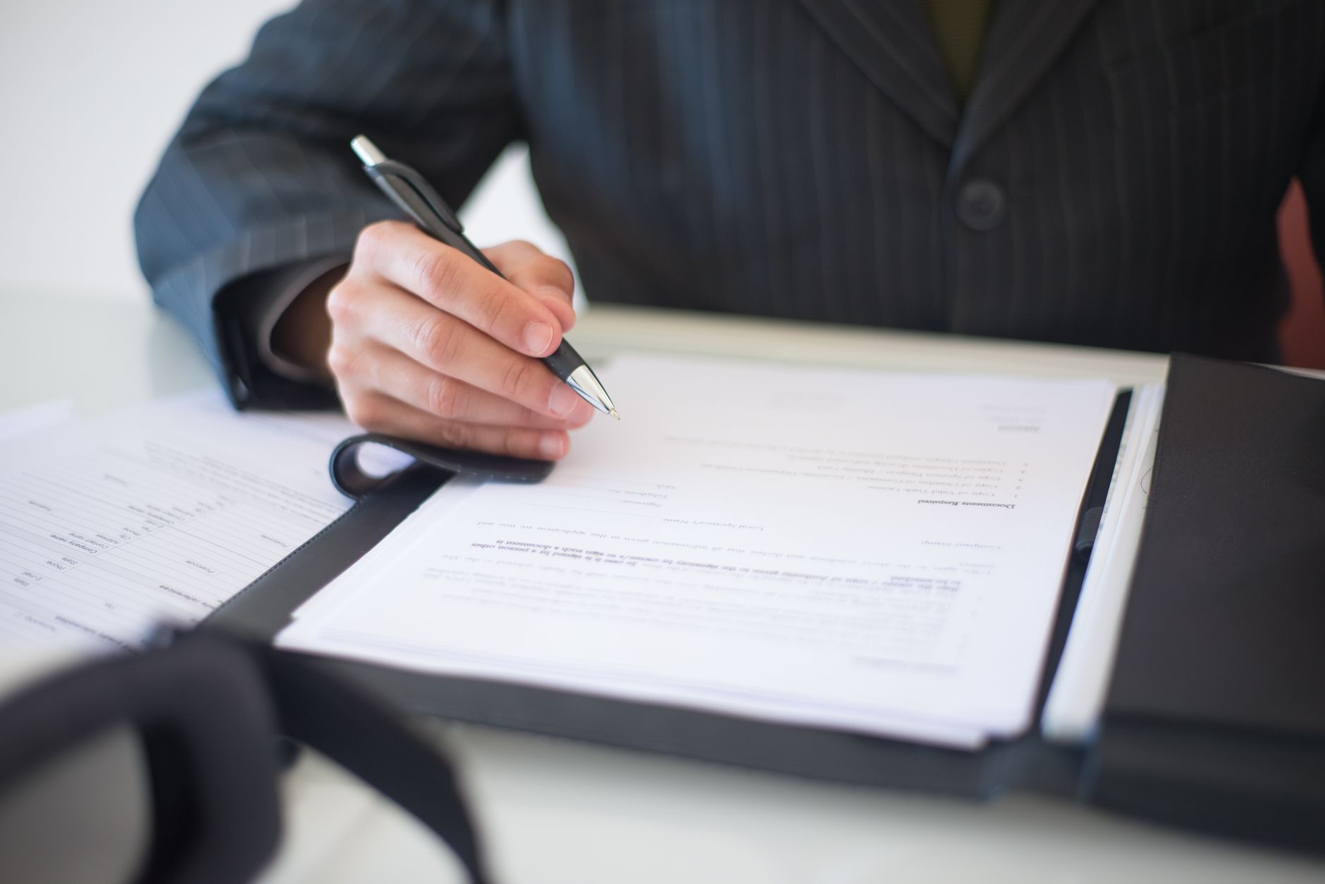 Financial analyst reviewing ETF fund documents and risk disclosures