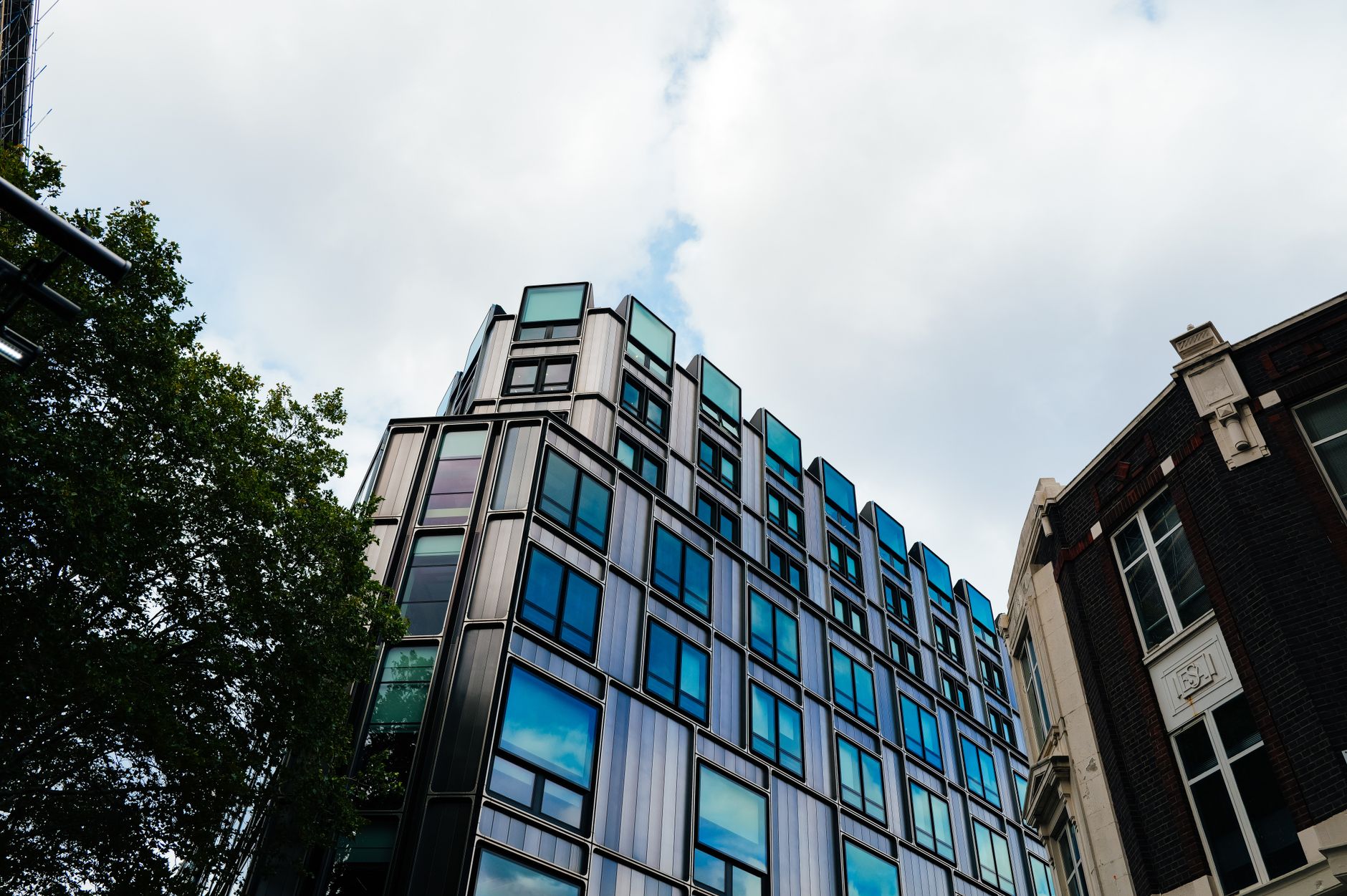 Modern commercial office building exterior reflecting financial market stress in real estate sector