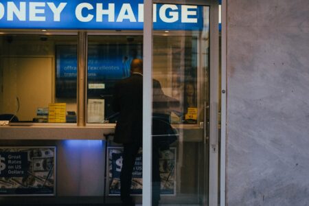 Currency exchange board showing dollar and foreign currency rates