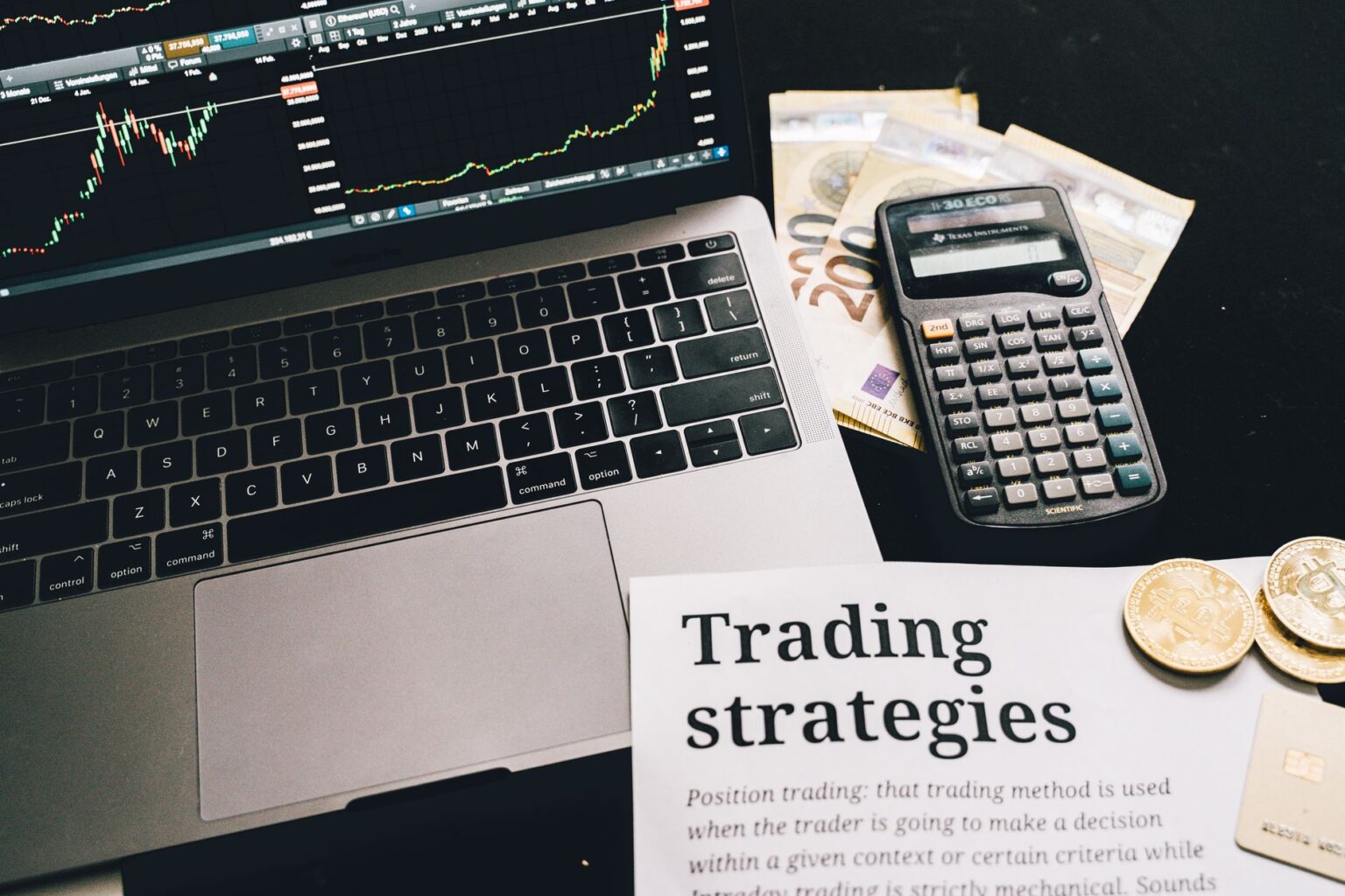 Traders working on a busy financial trading floor with multiple screens displaying market data