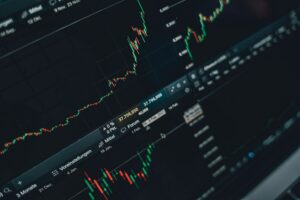 Traders monitoring equity and derivatives markets on multiple screens