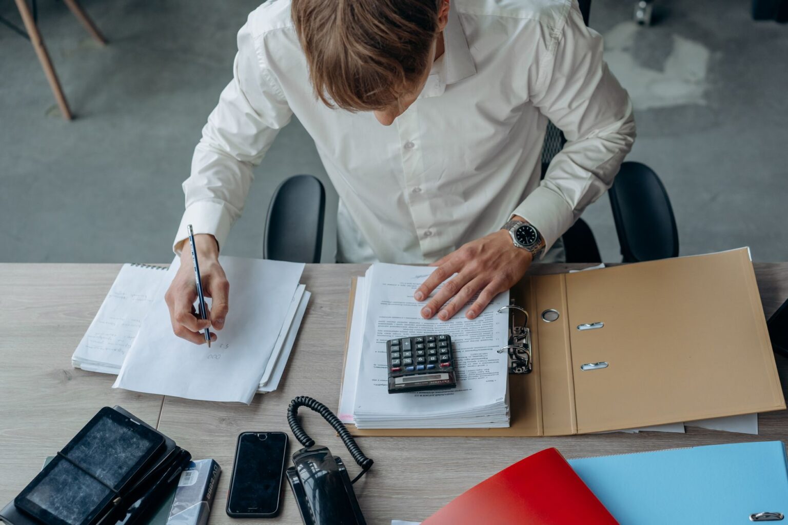 Loan-to-Value Compression Is Quietly Stressing Private Credit Covenants Financial documents and loan agreements spread across a desk representing private credit analysis