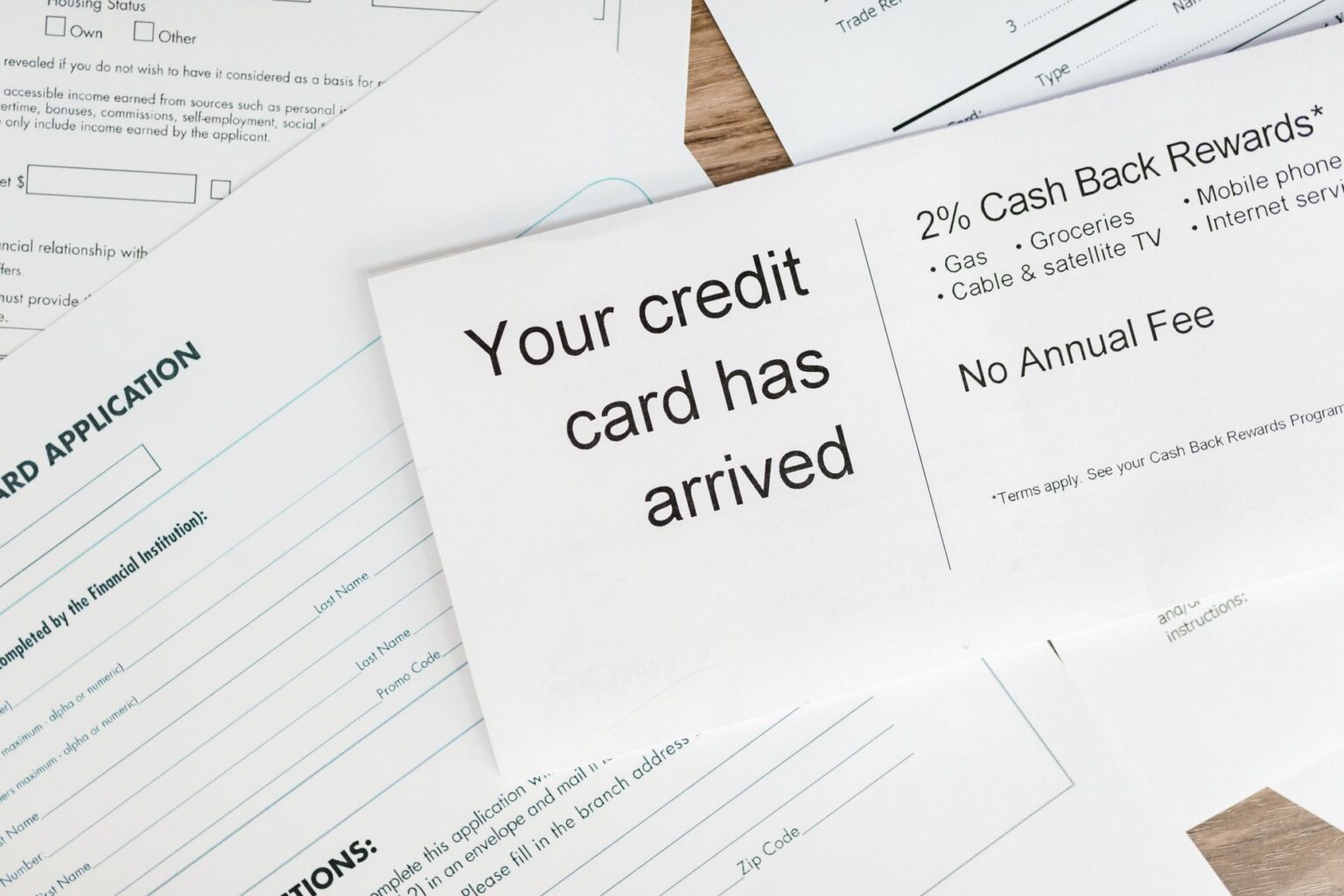 Auto loan paperwork spread on a desk representing subprime lending activity