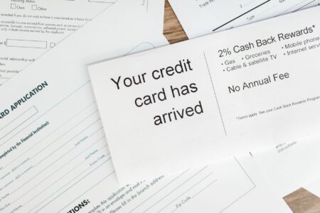 Auto loan paperwork spread on a desk representing subprime lending activity