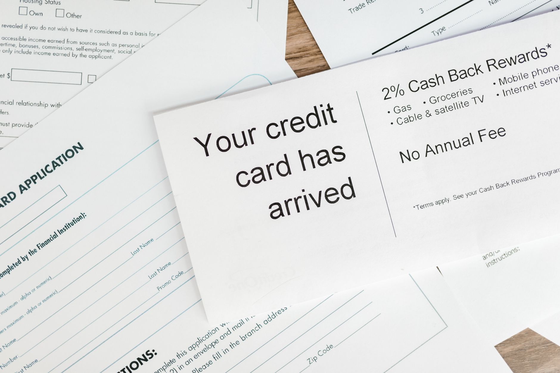 Auto loan paperwork spread on a desk representing subprime lending activity