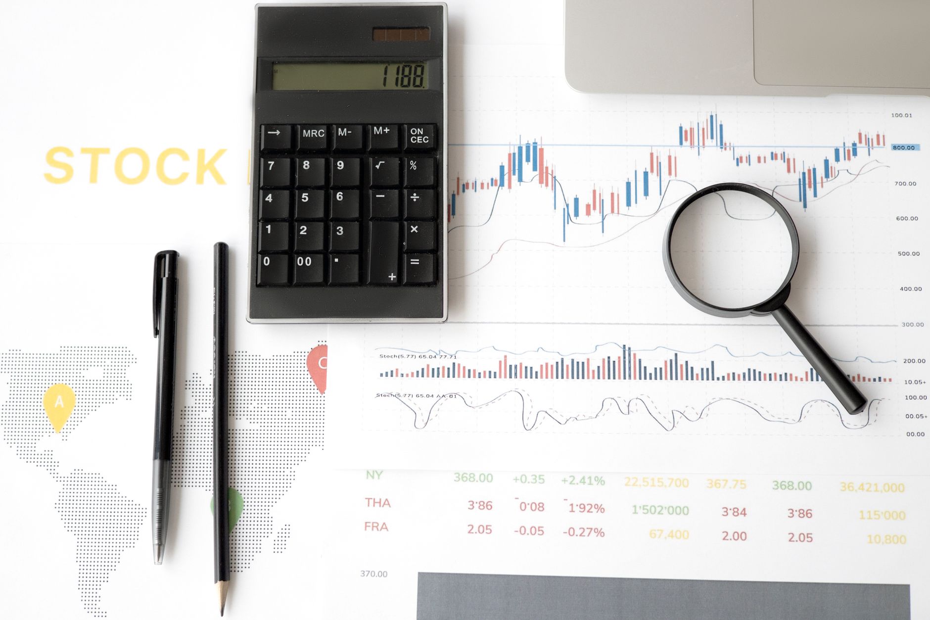 Stock market data screens showing price fluctuations and volatility indicators