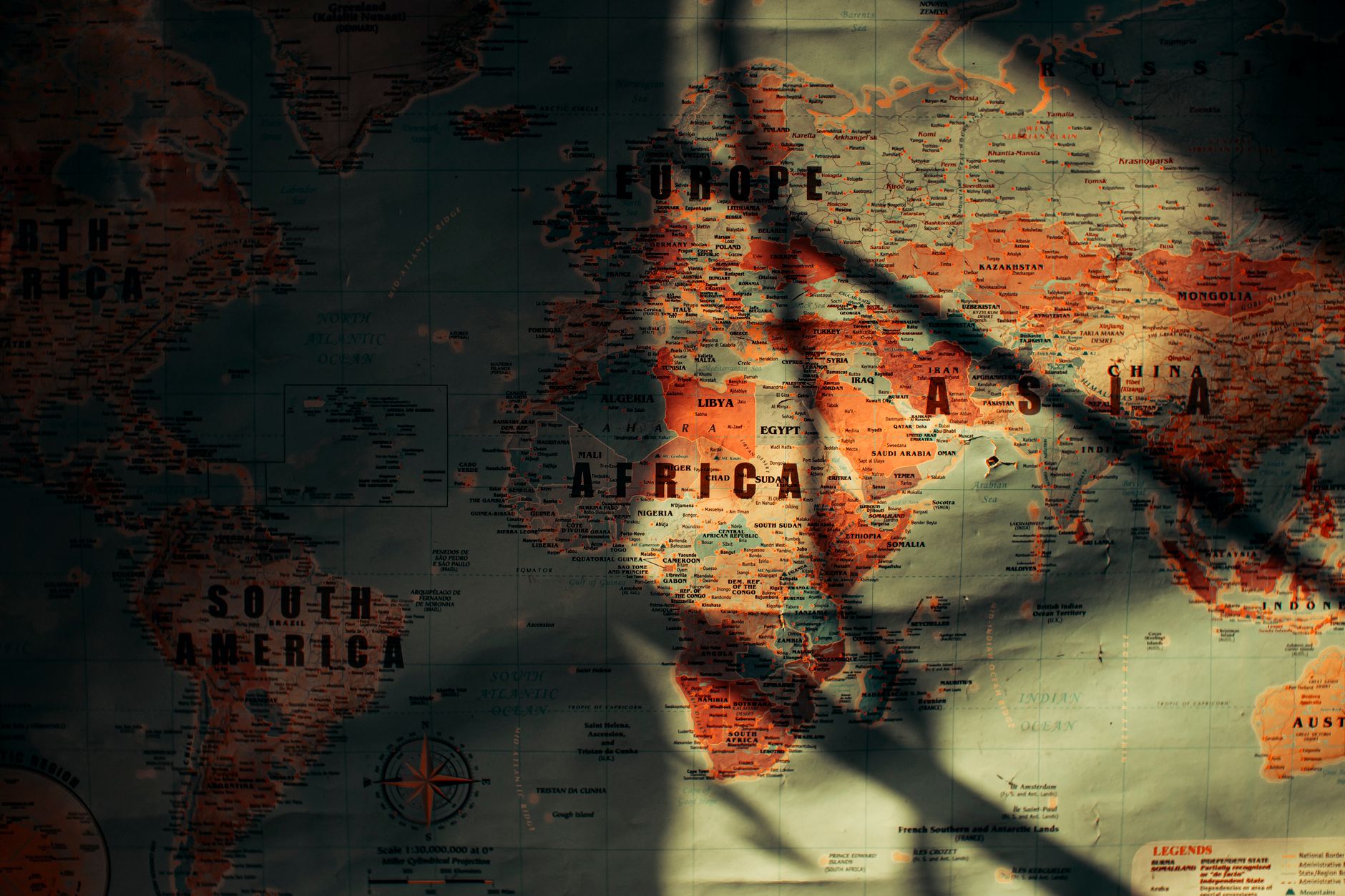 World map overlaid with financial data representing emerging market sovereign debt exposure