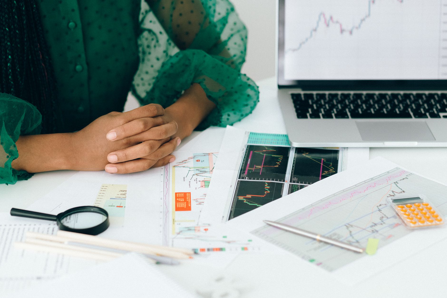 Risk analyst reviewing structured financial data at a trading desk