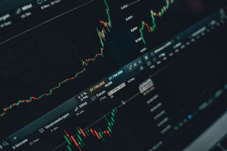 Equity Collar Financing Is Quietly Funding Insider Liquidity Events Close-up of financial stock market charts on a screen showing price movements and trading data