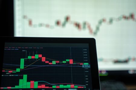 Financial trading screens displaying currency and credit market data