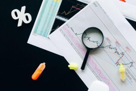 Interest Rate Collar Demand Is Quietly Repricing Corporate Hedging Costs Financial analyst reviewing interest rate charts on a desktop monitor