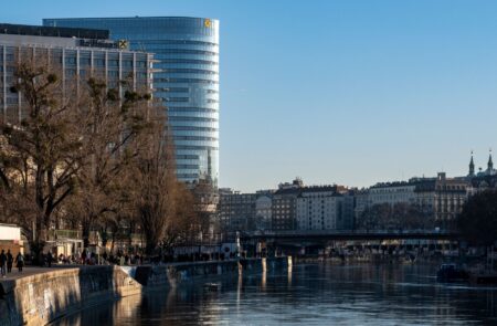 Covered Bond Spreads Are Quietly Tightening on European Bank Demand Exterior of a large European bank headquarters representing covered bond issuance activity