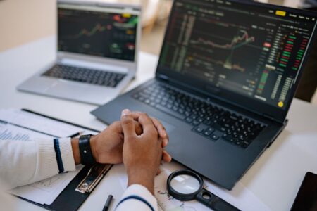 Multiple financial trading screens displaying interest rate and derivatives market data