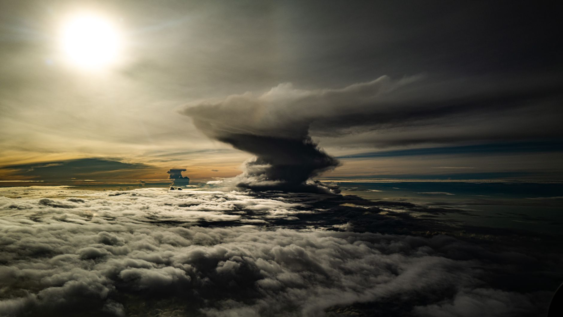 Dark storm clouds viewed from above representing catastrophic weather risk