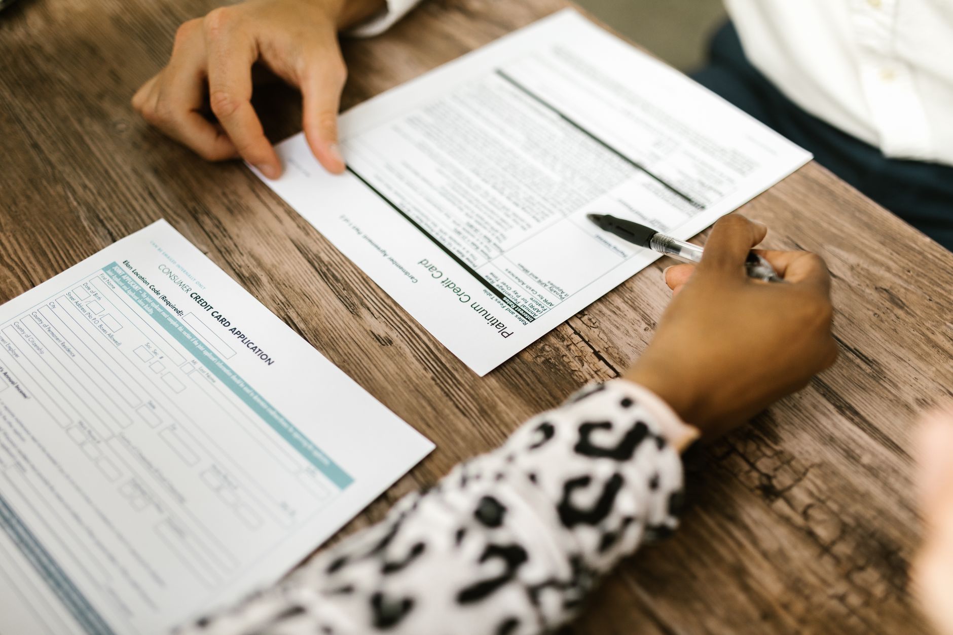 Close-up of financial documents and charts on a desk in a banking environment