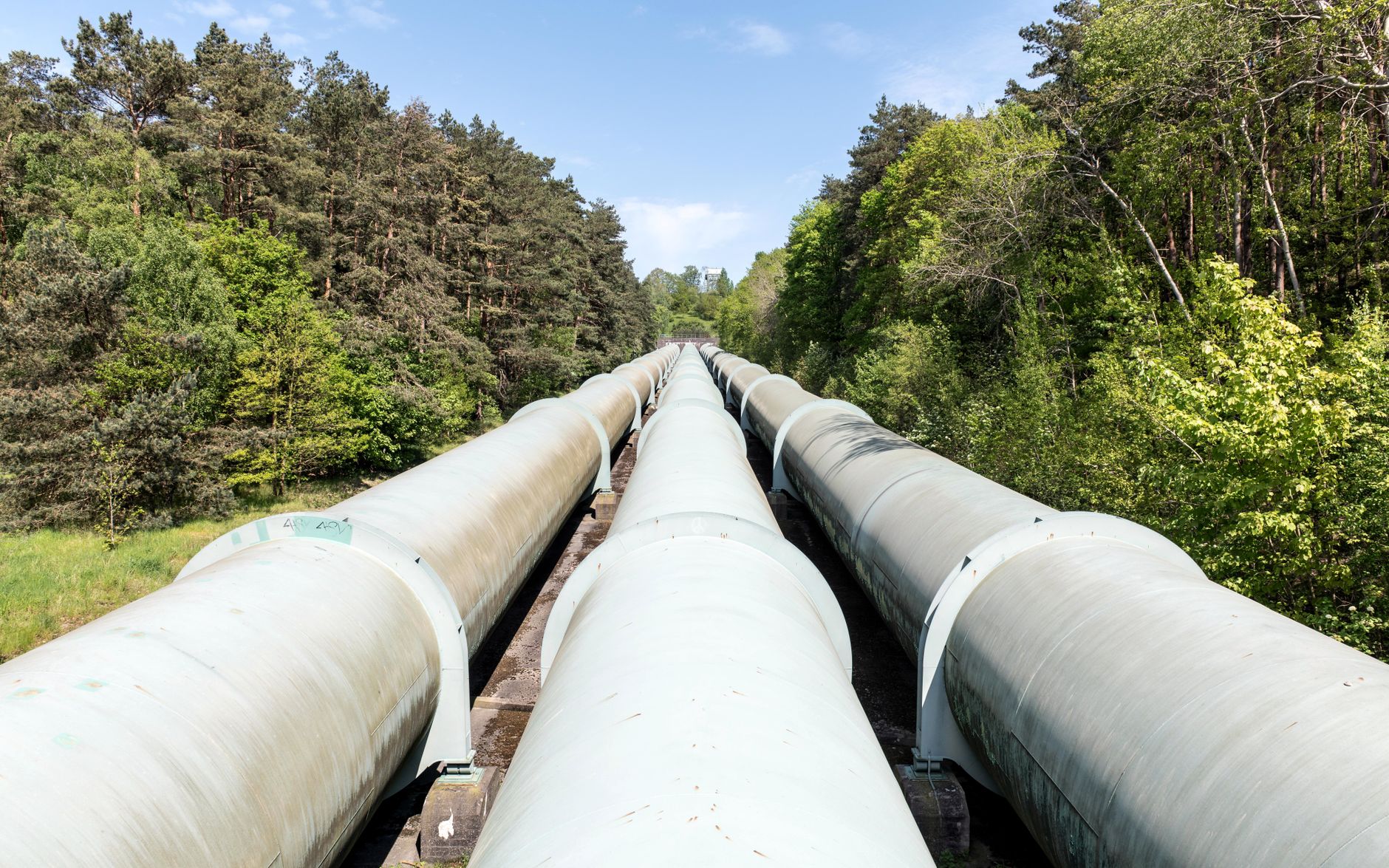 Industrial pipeline infrastructure representing the flow of assets through financial clearing systems