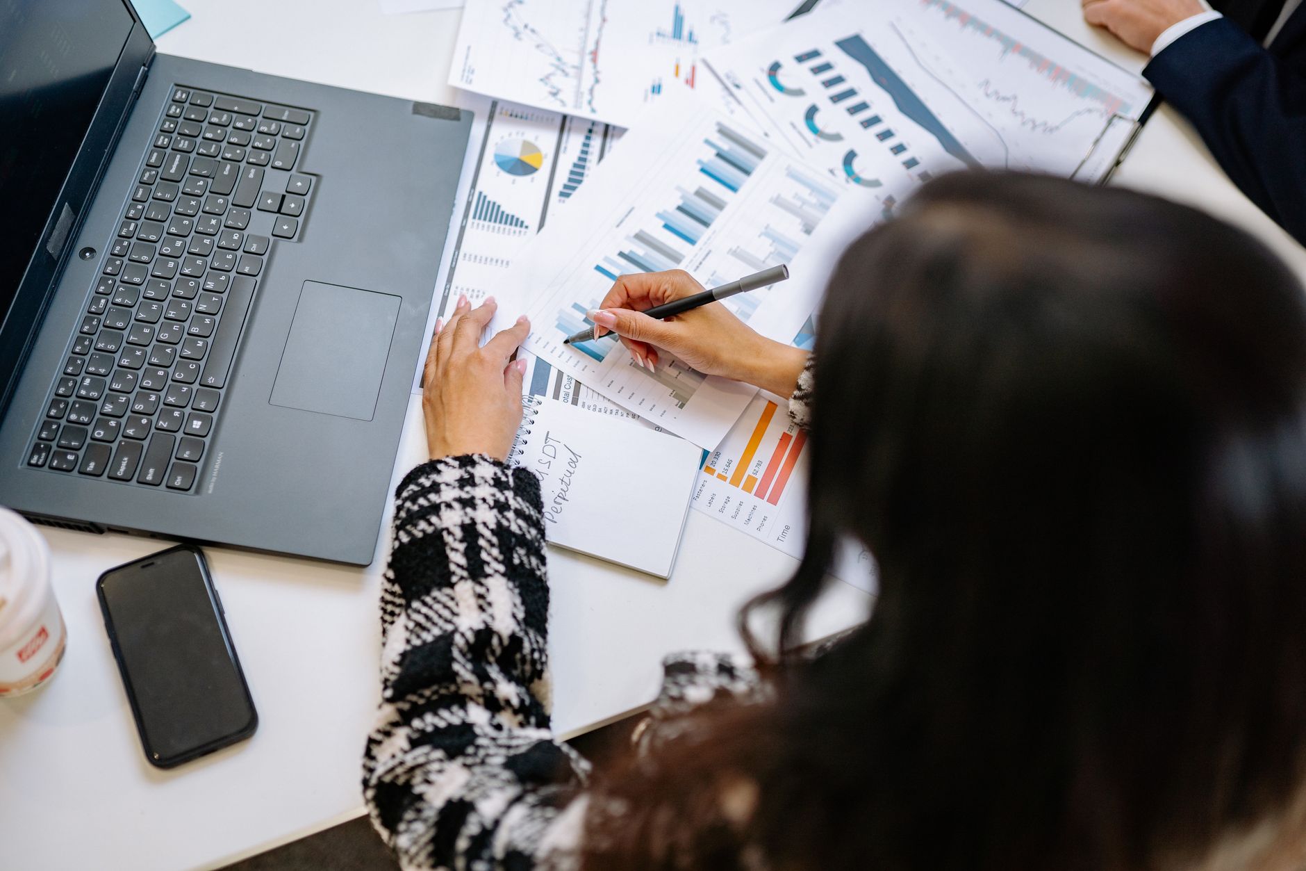 Finance professional at desk reviewing fixed income portfolio allocation documents