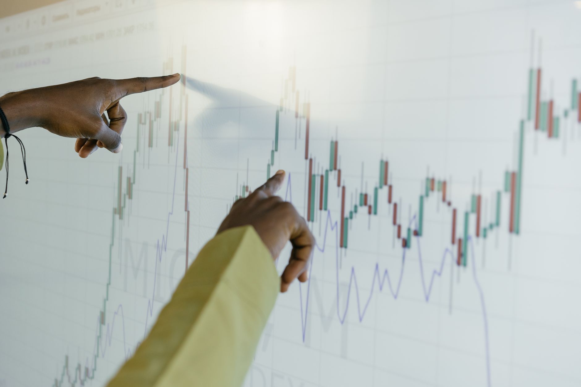 Professional reviewing risk analysis documents at a financial institution desk
